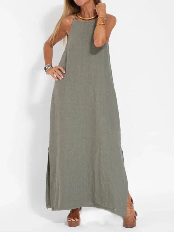 "Reece sleeveless maxi dress in black, V-neck, and side slit, made of soft crepe fabric, ideal for casual and evening wear."