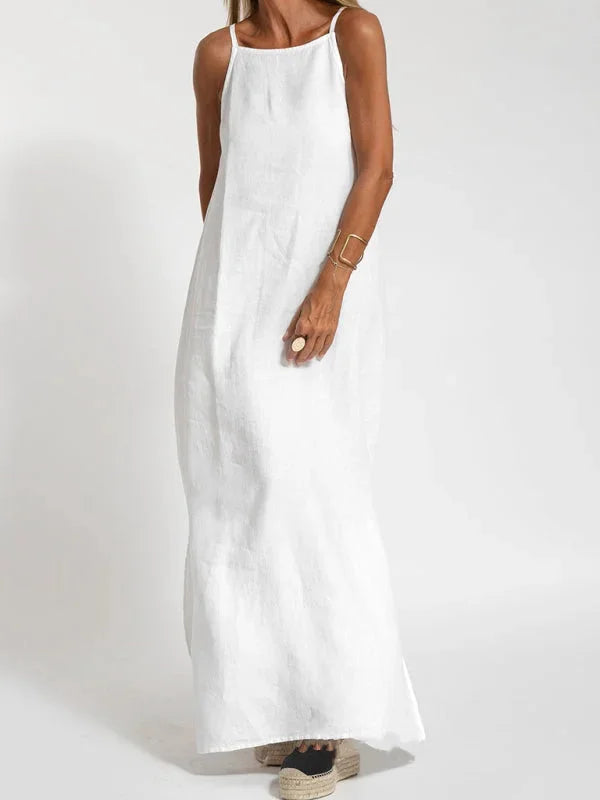 "Reece sleeveless maxi dress in white - featuring a flowing silhouette and airy fabric perfect for summer days."