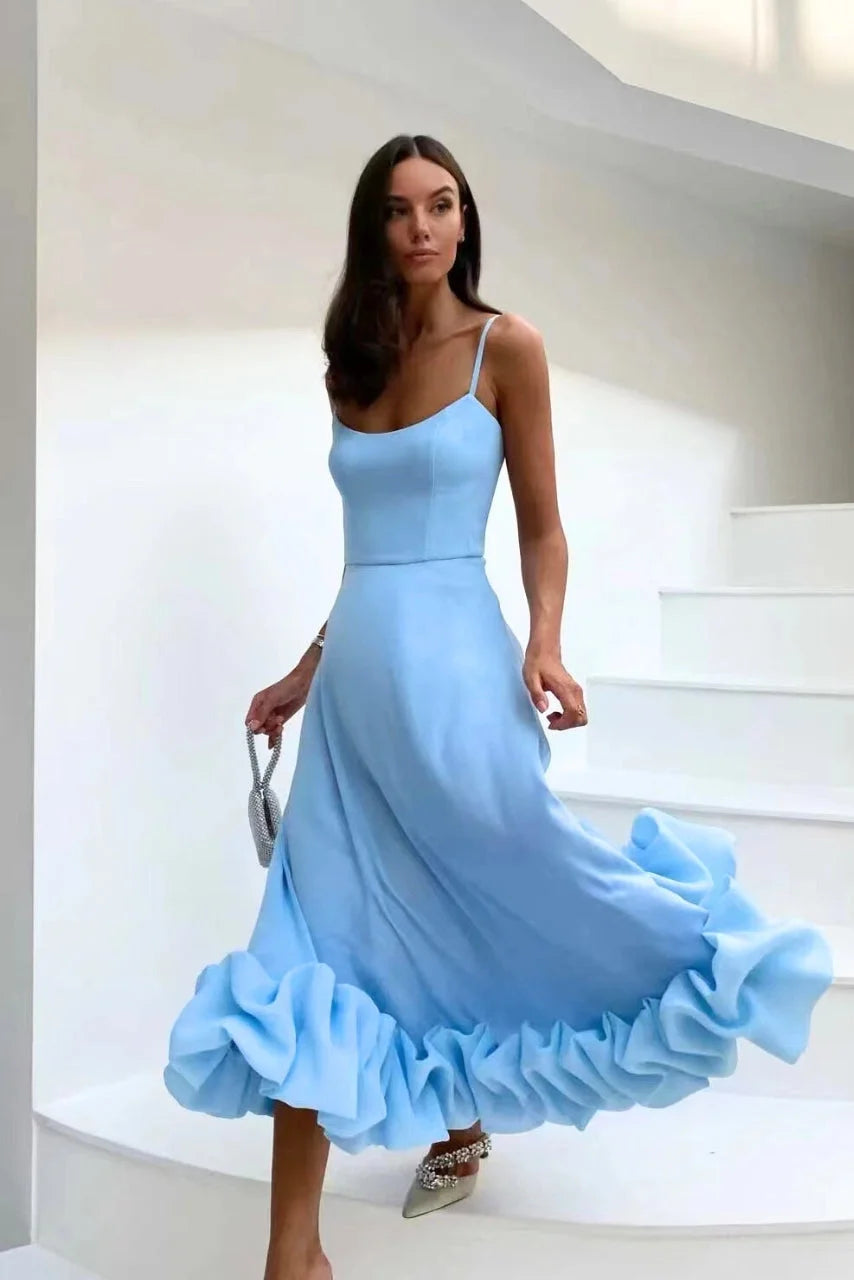 "Sleeveless dress with ruffled hemline, made from soft cotton blend. Perfect for a chic and charming look."