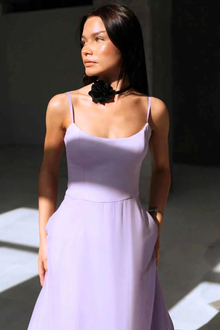 Sleeveless dress in light blue with a ruffled hemline, made of soft cotton blend fabric for a stylish and comfortable look.