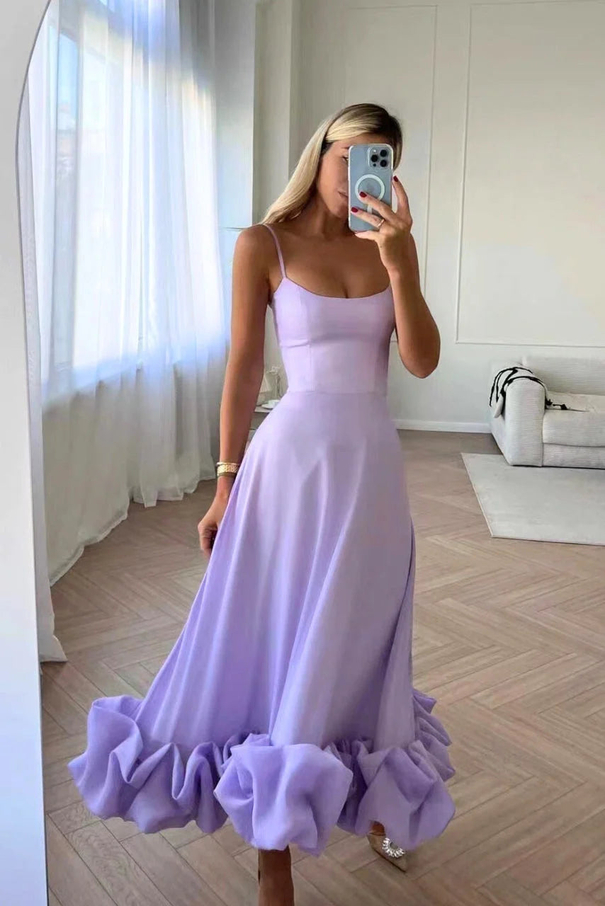 Purple sleeveless dress with ruffled hemline, perfect for summer. Made with lightweight fabric, elegant design for a chic…