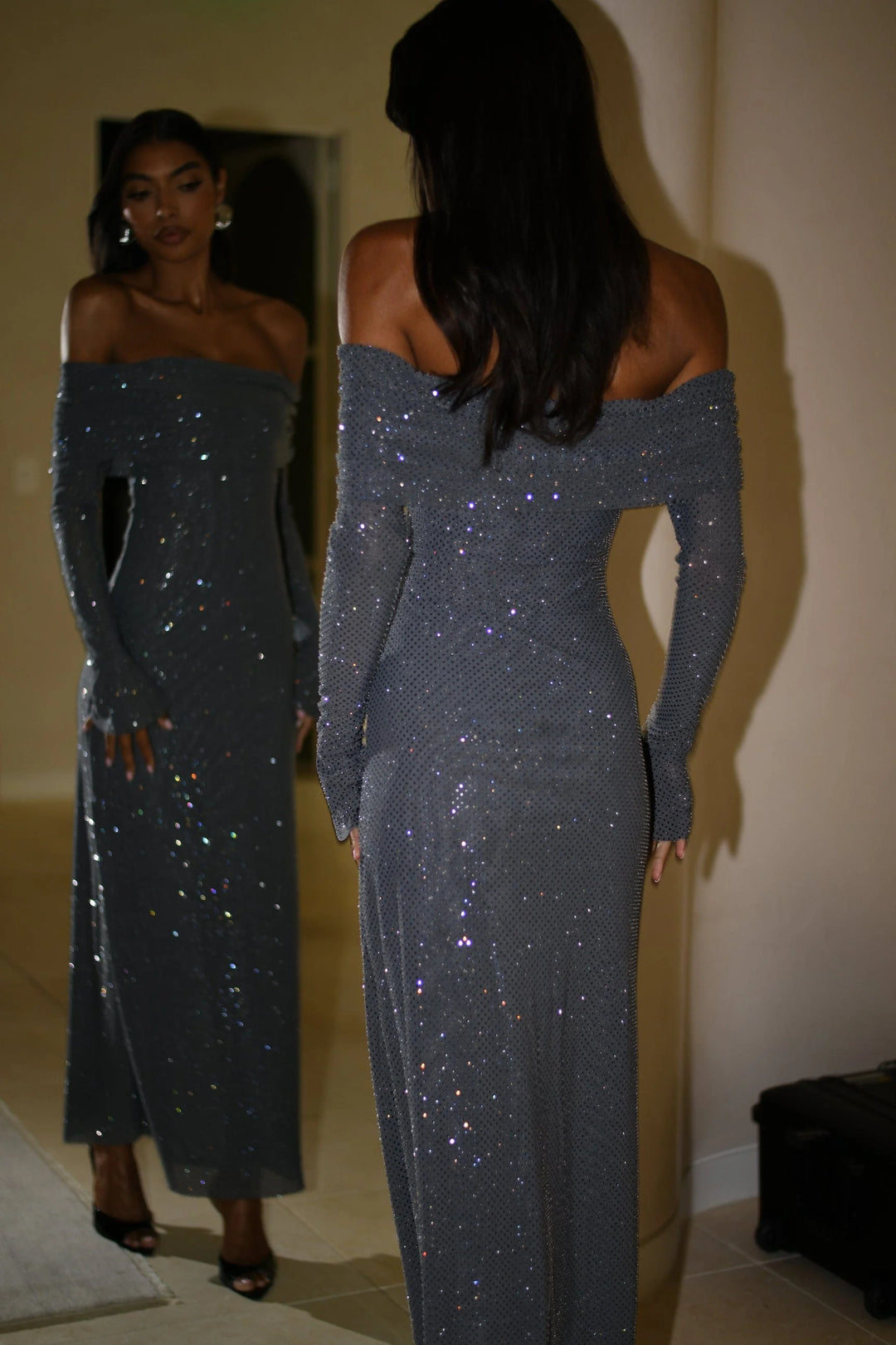 "Aubri long dress in shimmering fabric with elegant shoulder detailing"