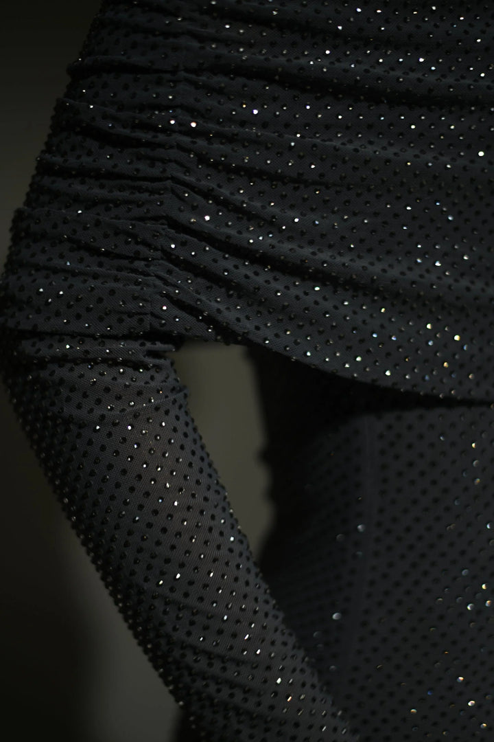 Shimmery Stormy long dress with unique shoulder details, perfect for formal events or special occasions.