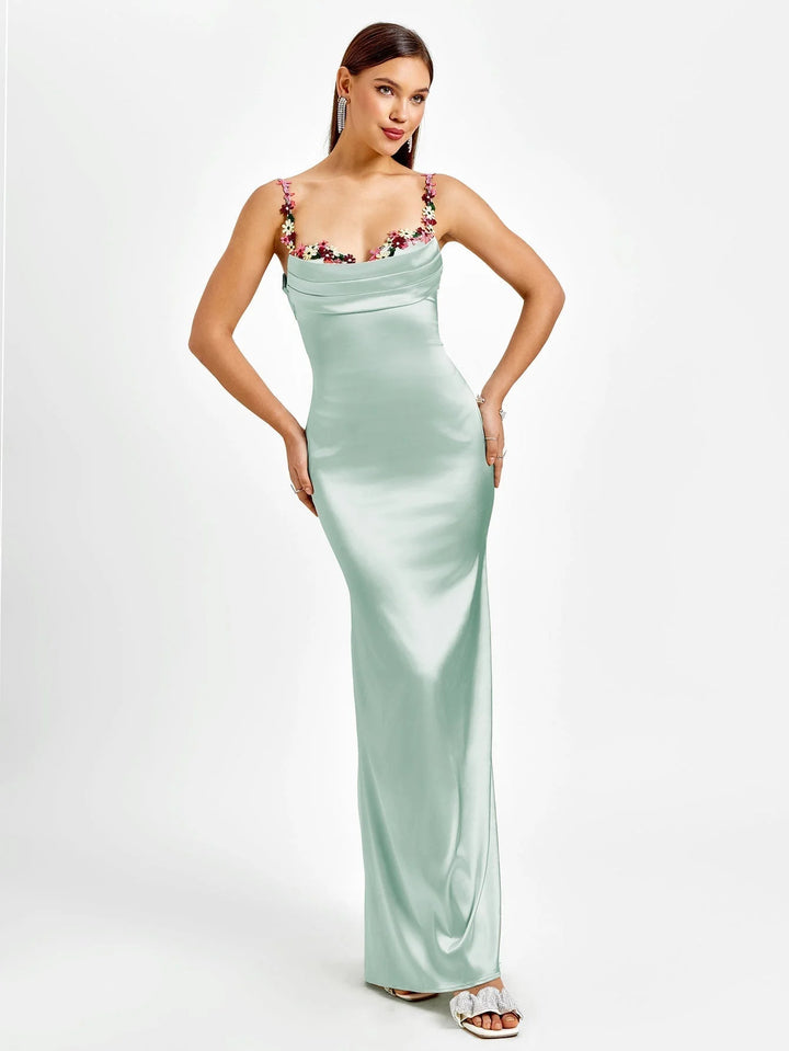 "Sleeveless maxi dress with embellishments, perfect for special occasions. Soft and comfortable fabric in deep navy color."