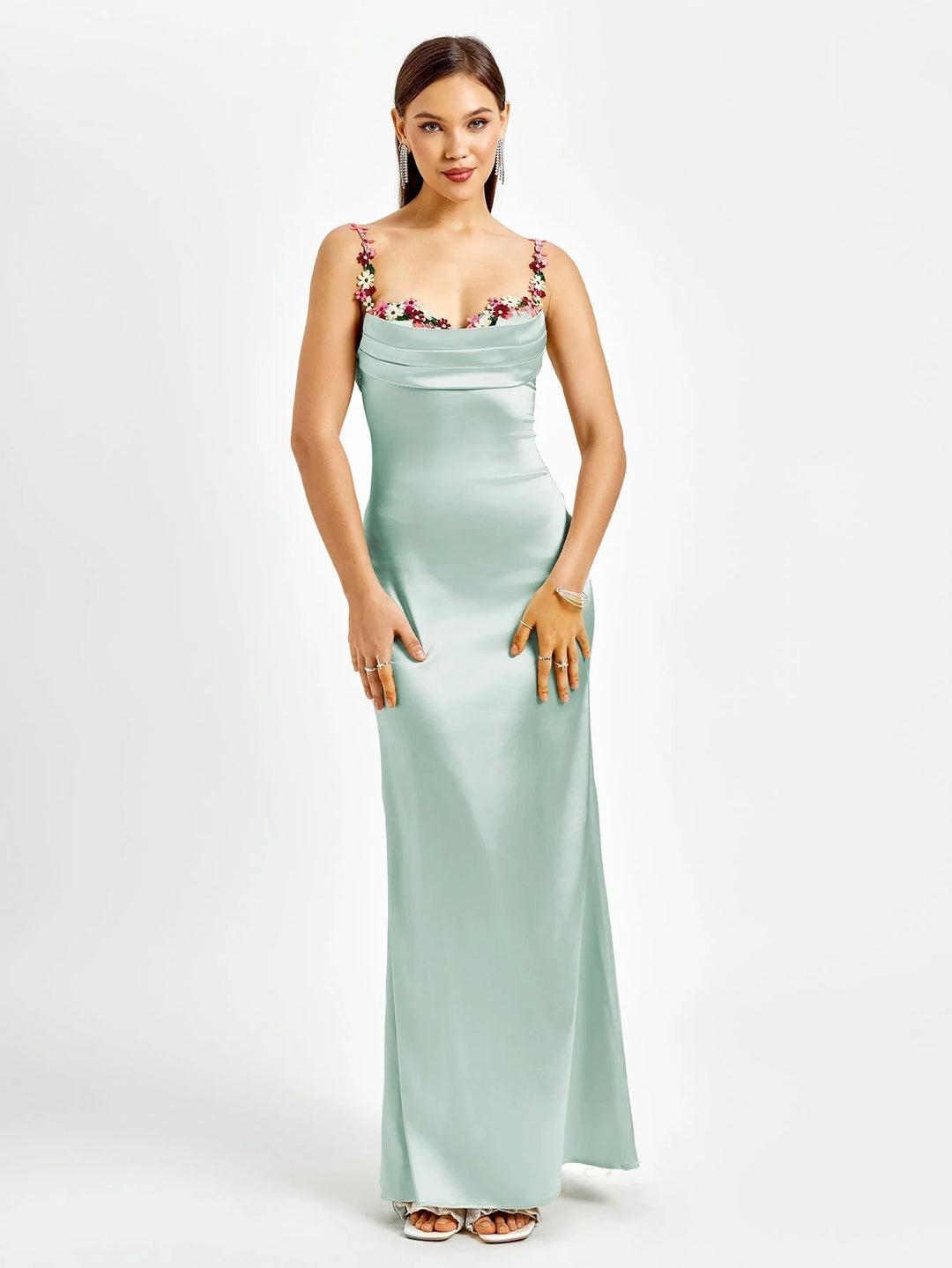 Sleeveless black maxi dress with intricate embellishments, form-fitting silhouette, perfect for special occasions or elegant…