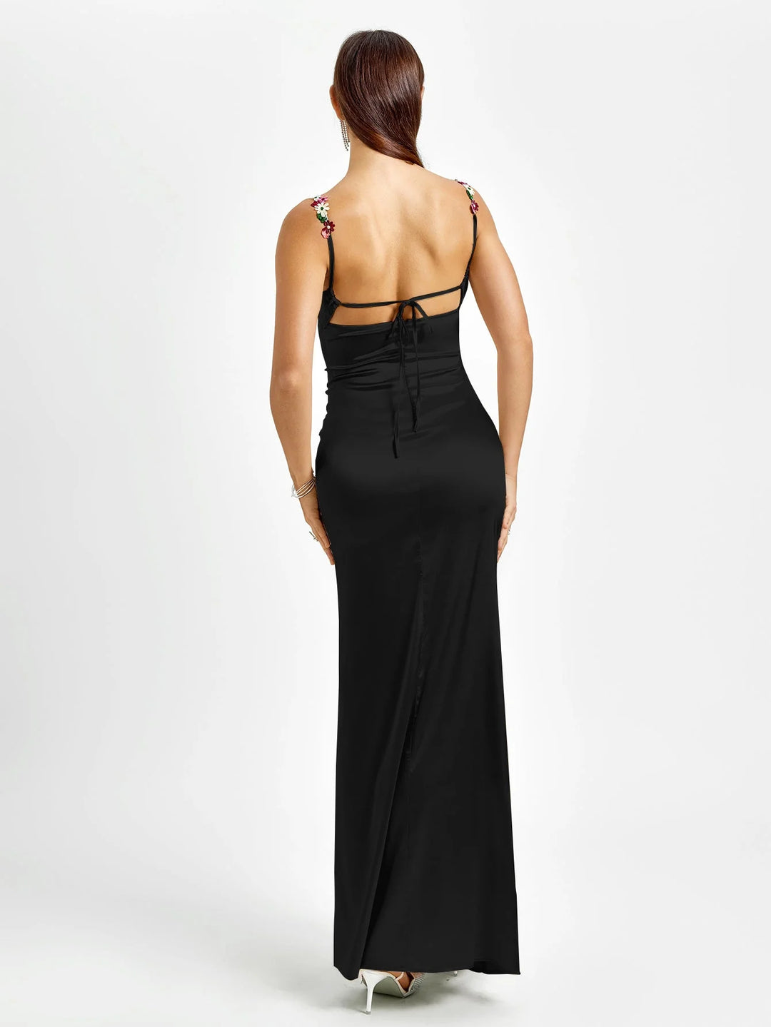 "Sleeveless maxi dress with embellishments in soft blue, perfect for special occasions. V-neck and fitted silhouette add…