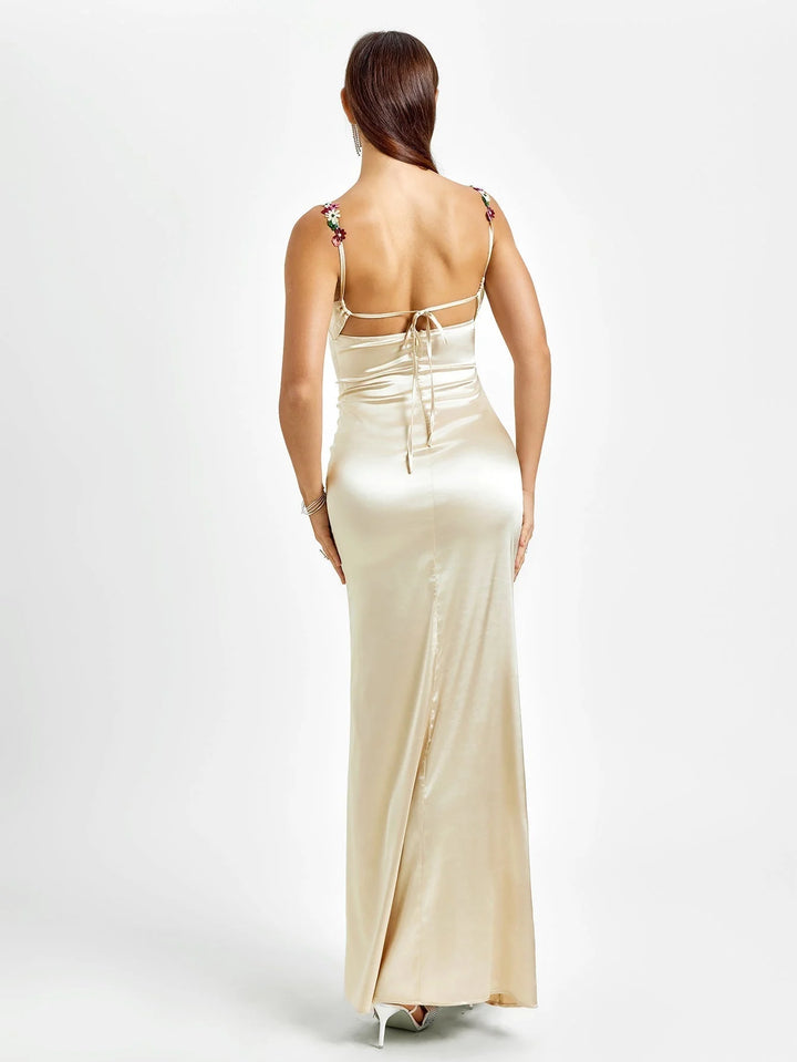"Sleeveless fitted maxi dress adorned with embellishments for a polished look. Made with high-quality materials for all-day…