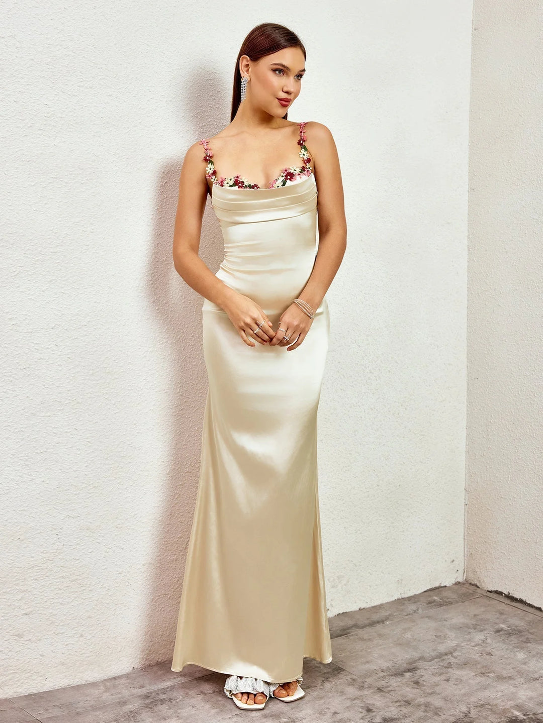 "Sleeveless maxi dress featuring delicate embellishments for a chic look."