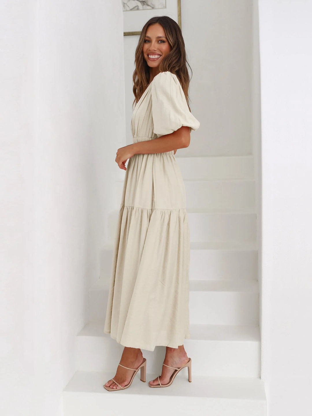 Navy blue v-neck midi dress with an elastic waist, perfect for casual or formal occasions. Made from comfortable and…