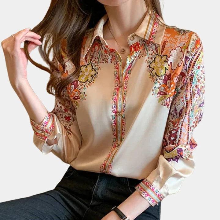 "Romi multicolor floral blouse with a versatile design, perfect for any occasion. Made of soft, breathable fabric."