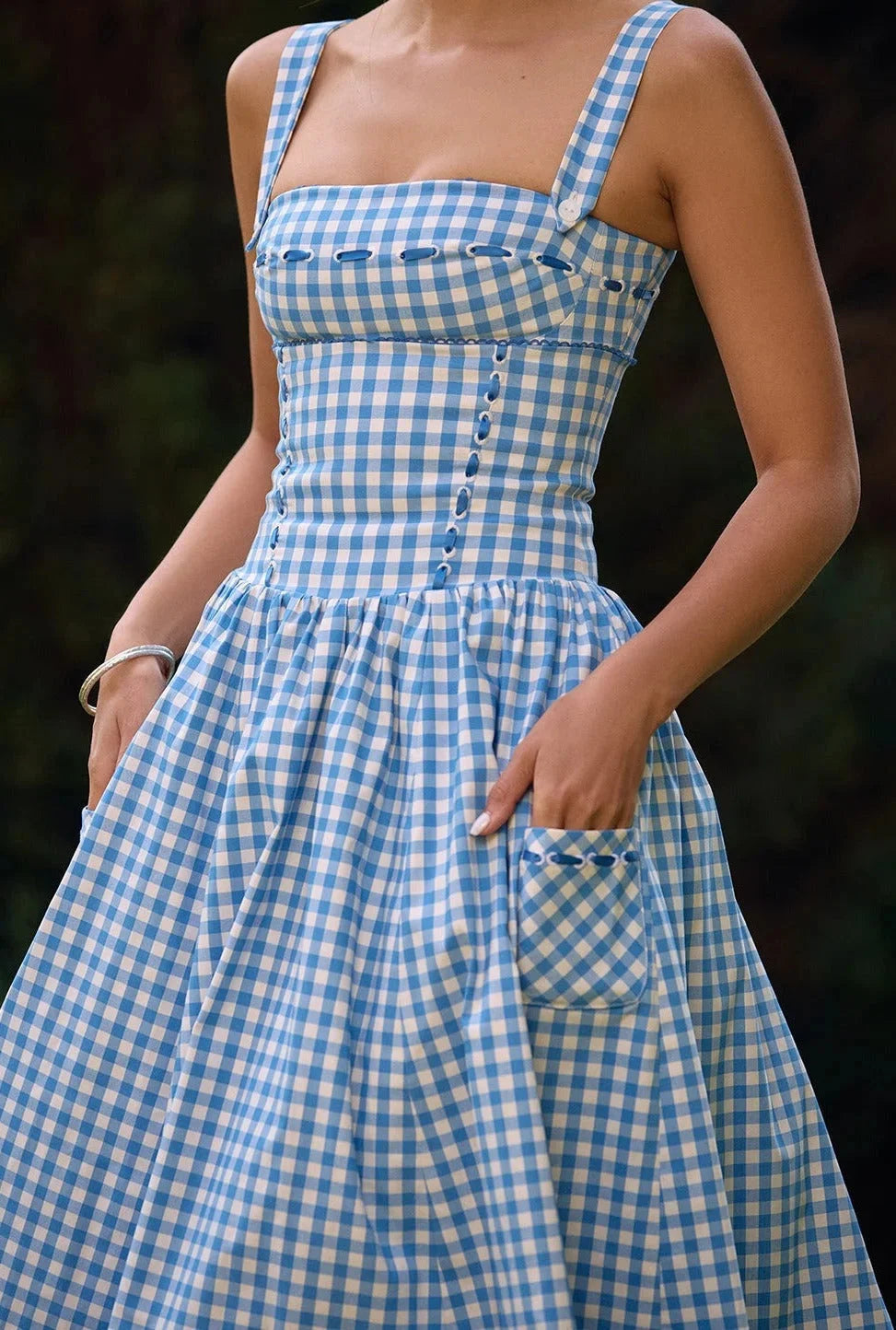 Off-shoulder midi dress in summery blue showcasing a delicate floral print. Perfect for warm-weather occasions.