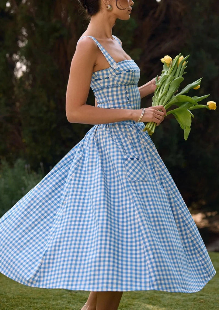 "Asuna off-shoulder midi dress in summery blue, perfect for warm weather. Features a relaxed silhouette and a stylish…