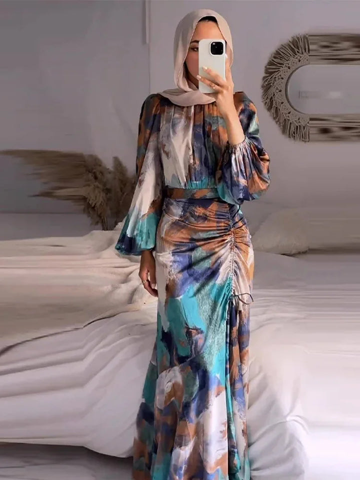 "Multicolored pleated maxi dress with sleeves made of lightweight breathable fabric in a striking design."