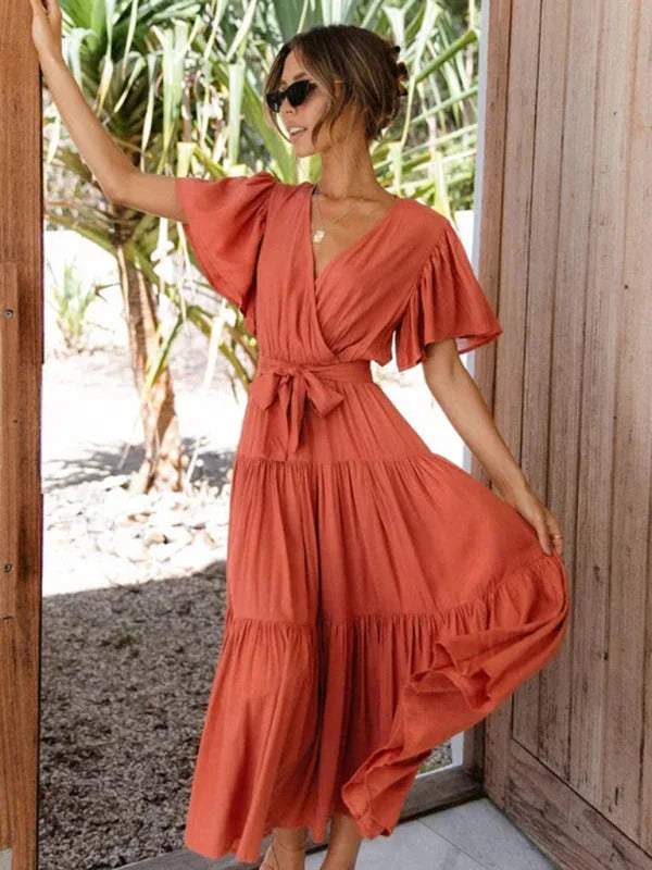 "Kaleigha Tiered midi dress with belt in light floral pattern, perfect for a casual day out or special occasion."