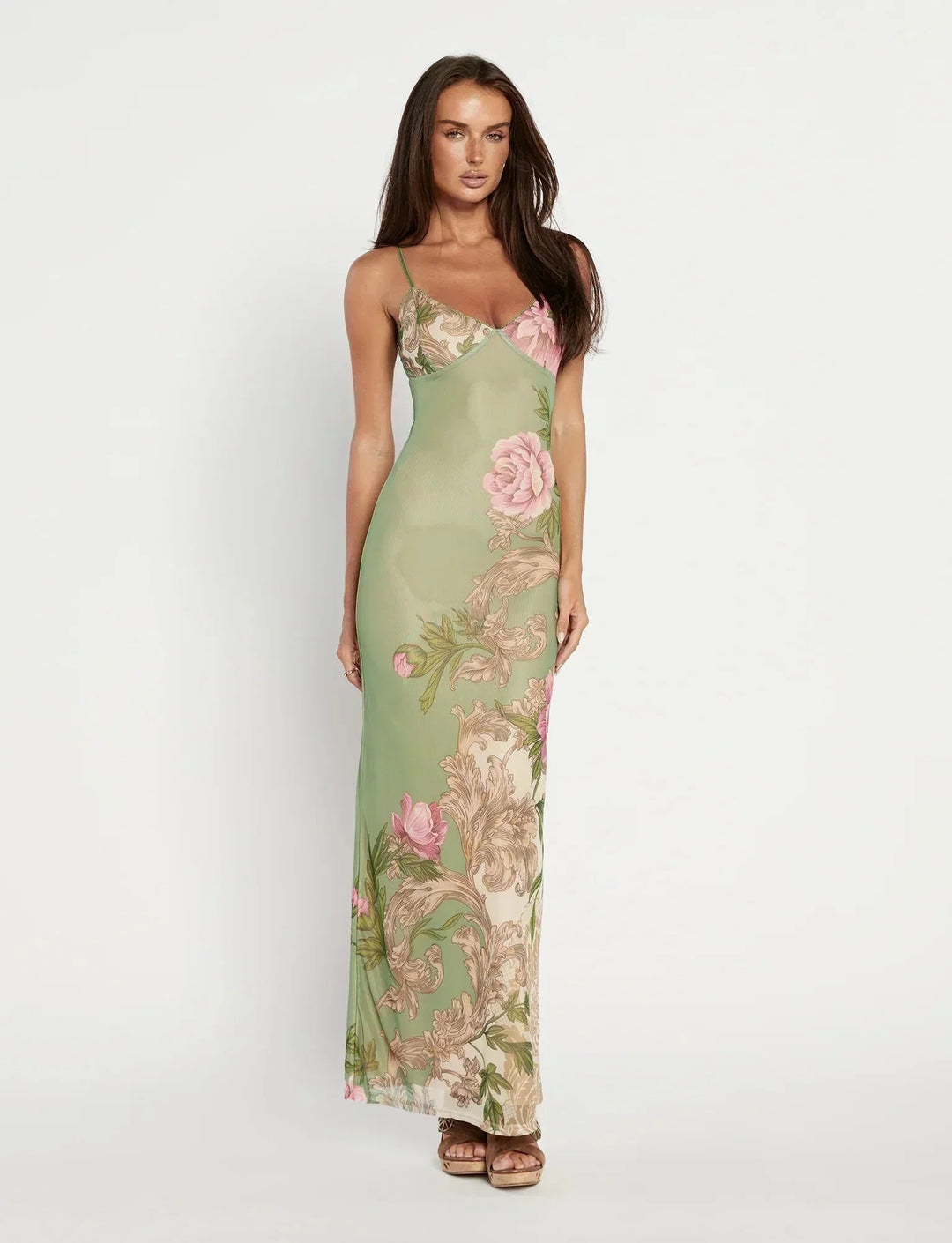 Form-fitting floral maxi dress with a delicate floral pattern and a sleek silhouette by Makena, perfect for a summer garden…
