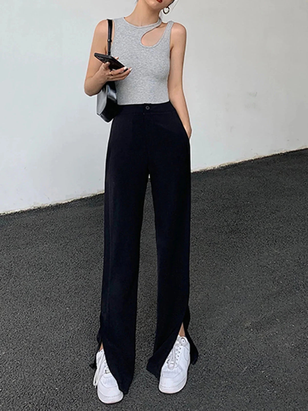 Asymmetric ribbed knit sleeveless top, showcasing modern design with a textured pattern, perfect for chic everyday wear.