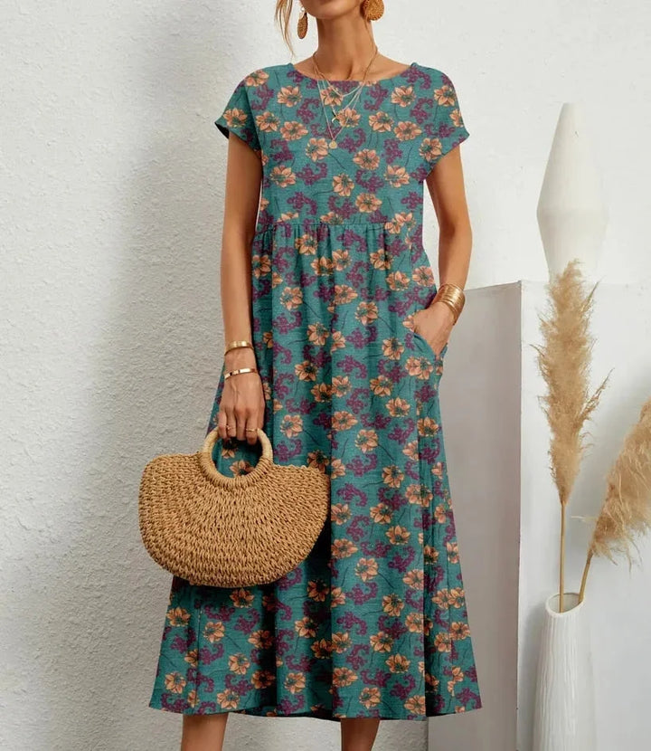 Blue floral print midi dress made of soft cotton fabric by Yamilet. Ideal for a casual chic look in any season.