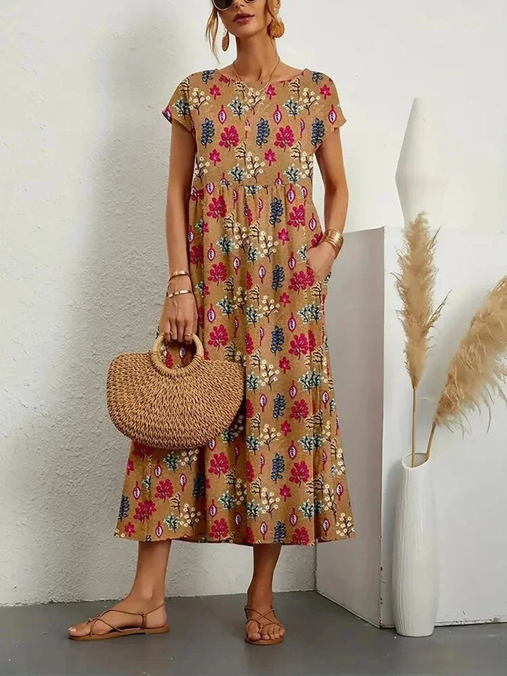 Brown cotton midi dress with charming floral print, perfect for a casual yet stylish look.