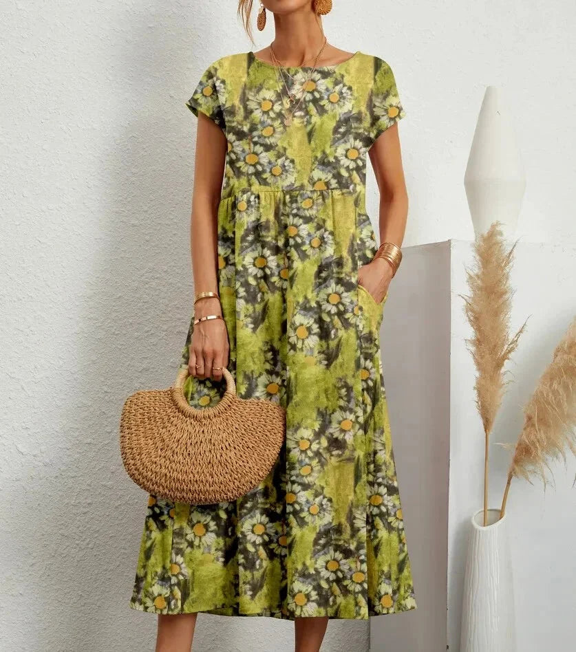 Light green cotton midi dress with intricate floral print design in Yamilet collection. Perfect for a chic and effortless…