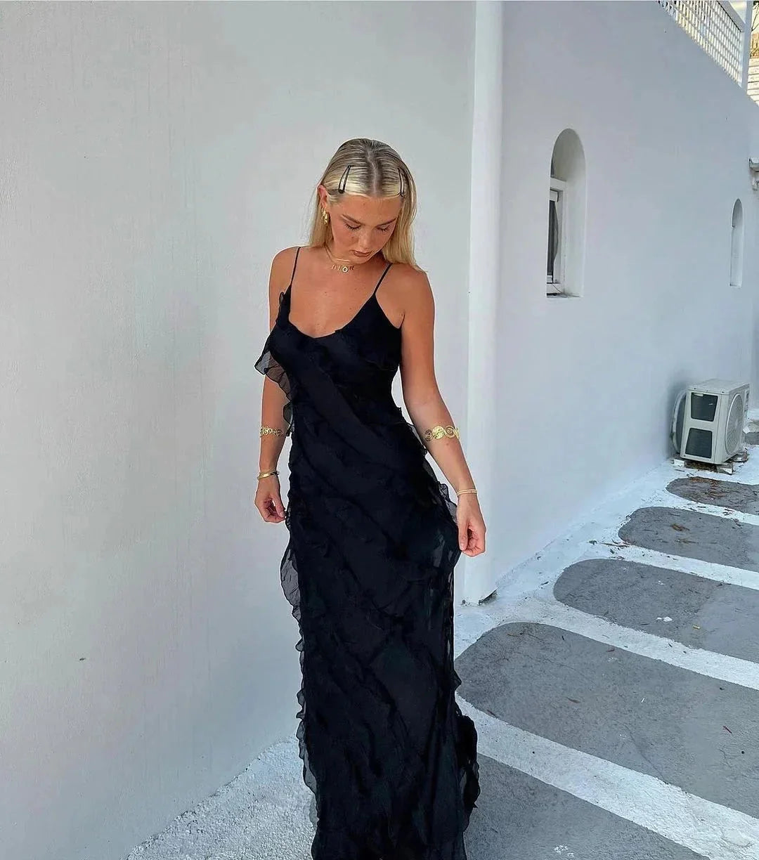 "Briar dress featuring elegant ruffles and a flowing maxi design, perfect for evening events. Made from high-quality silk…