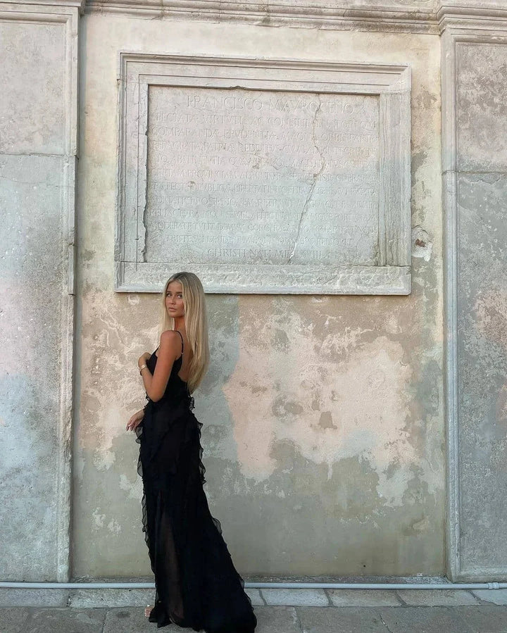 "Briar maxi dress with elegant ruffled detailing, ideal for evening events. Flowy fabric in a flattering silhouette."