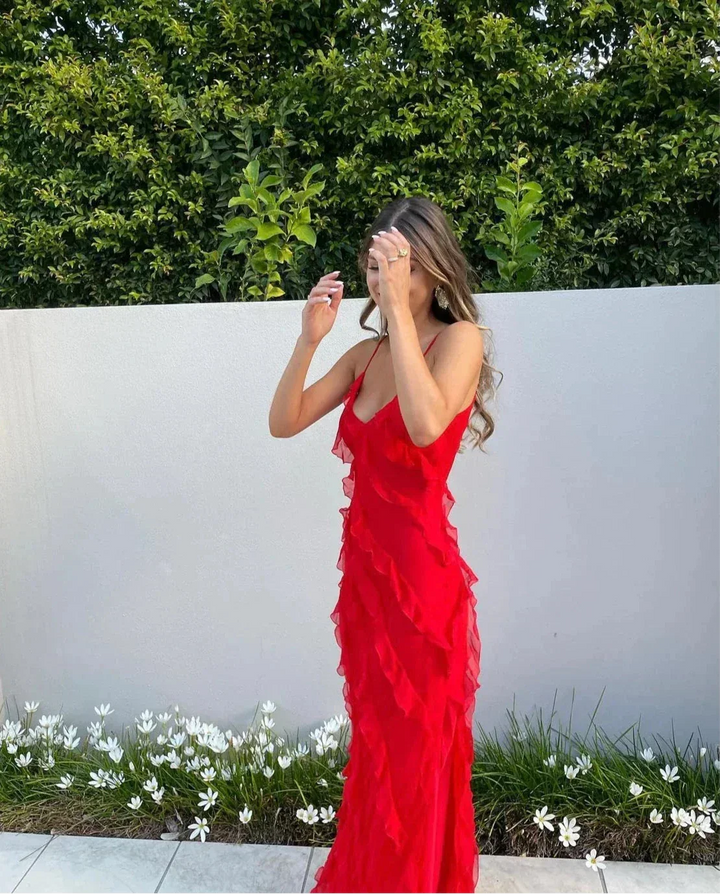 "Briar ruffled maxi dress in black for evening events, featuring a flowy design with subtle ruffles and a sophisticated…