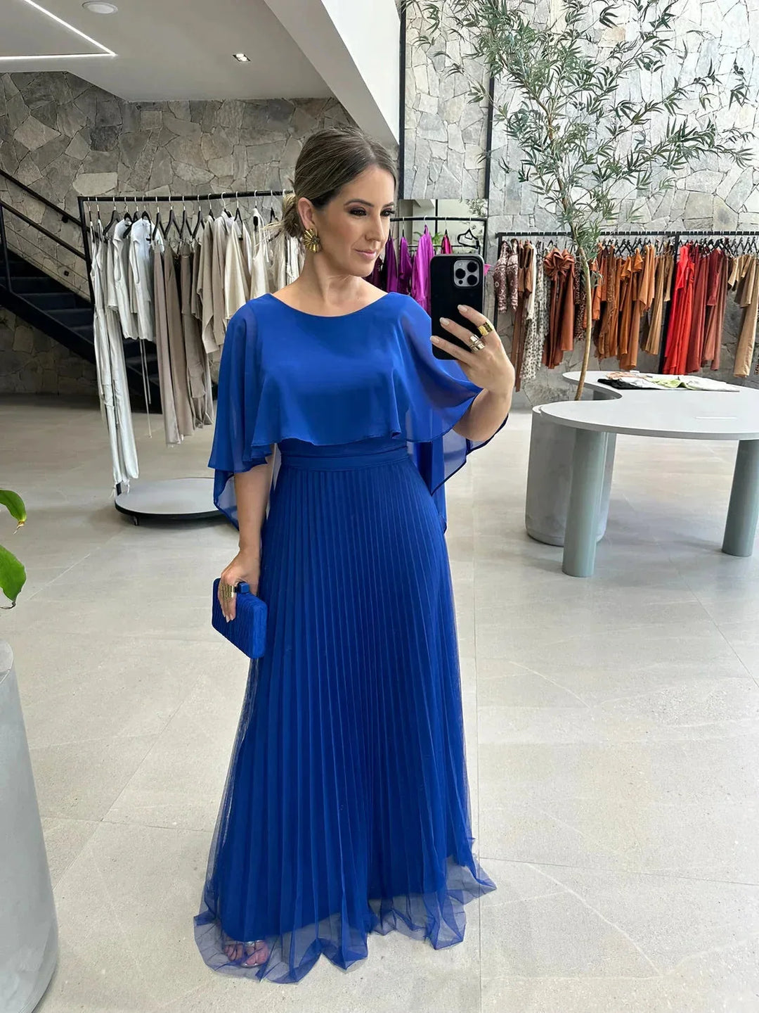 Floor-length dress with elegant flowing sleeves, perfect for formal occasions. Made with high-quality fabric in a flattering…