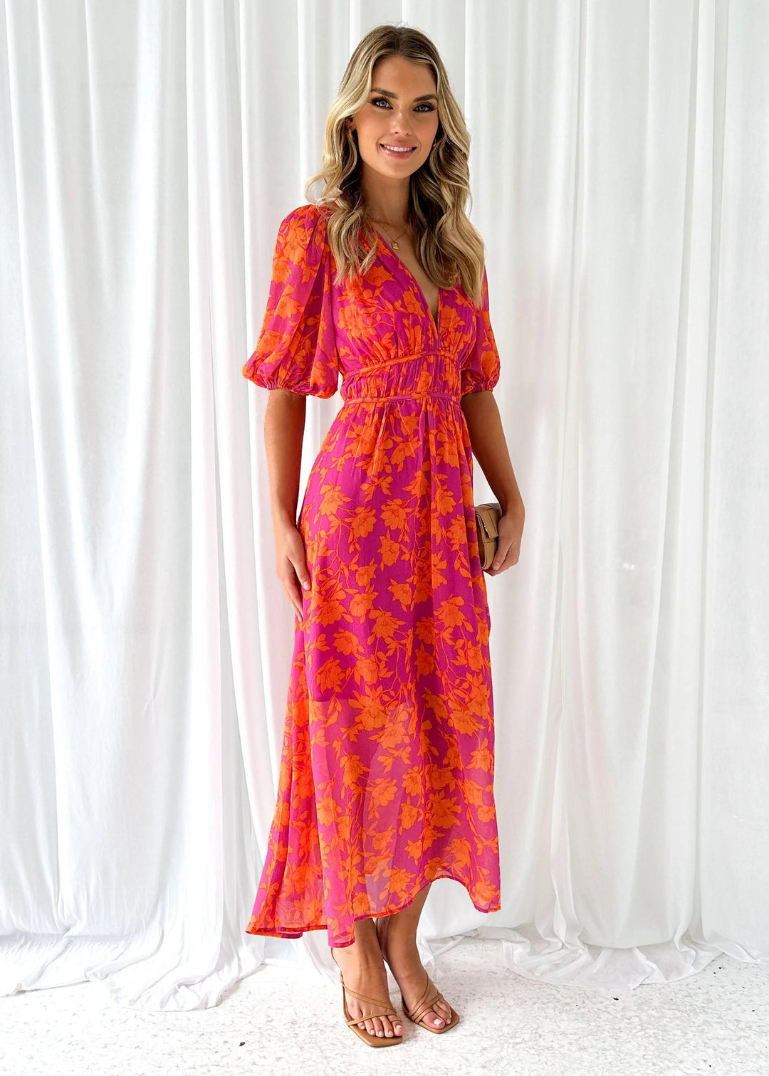 Bright pink floral maxi dress with a whimsical Manal pattern, perfect for summer events. Made from lightweight, breathable…