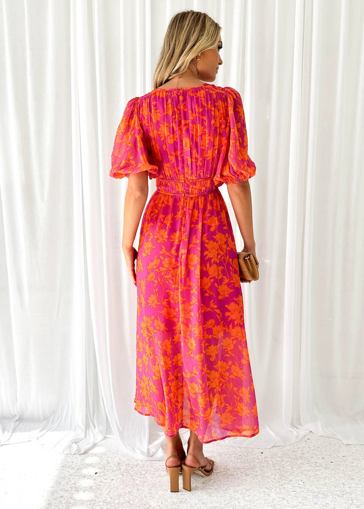 "Manal - Bright pink floral maxi dress featuring a lively floral pattern in a flowing silhouette."