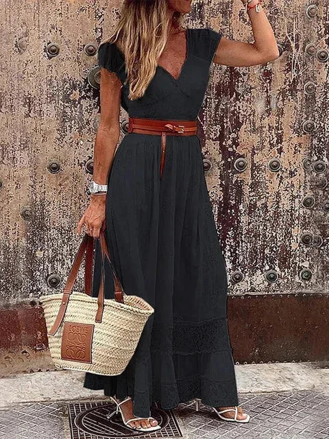 Black lace maxi dress with a V-neck and belted waist, perfect for elegant occasions.