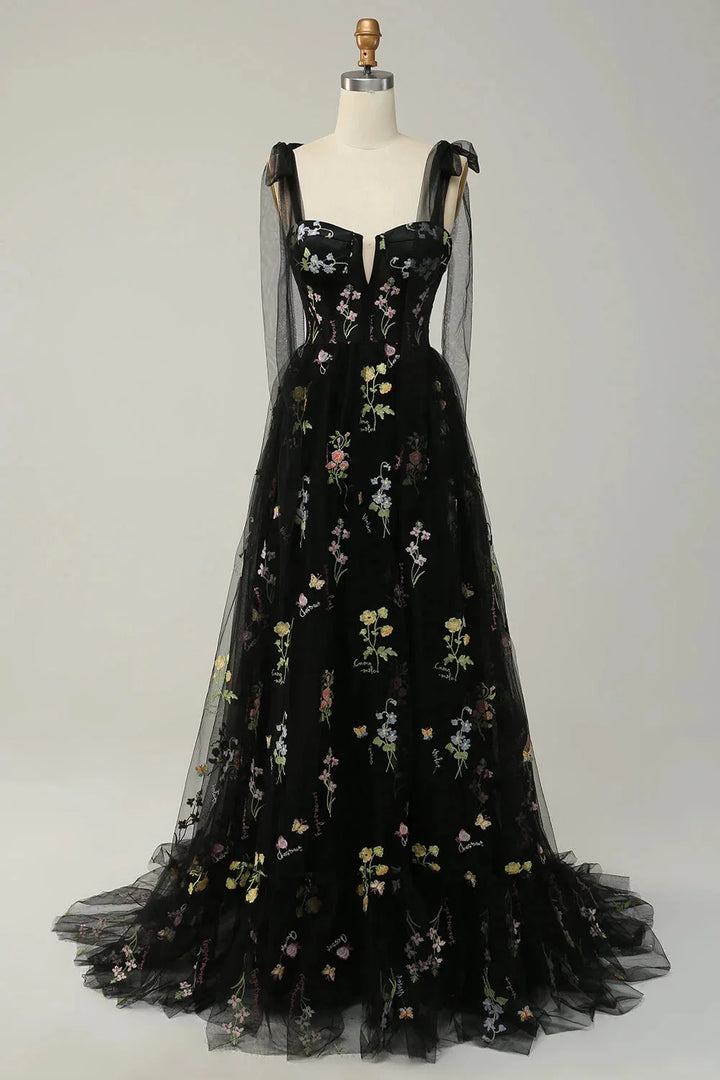 Pink tulle dress with delicate embroidery and sheer overlay by Bianca. Perfect for a special occasion or event.