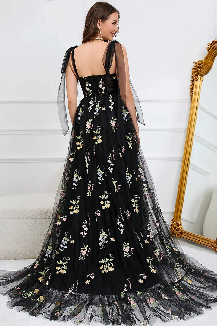 White Bianca dress with intricate embroidery on tulle fabric, featuring a sheer overlay for a romantic and elegant look.
