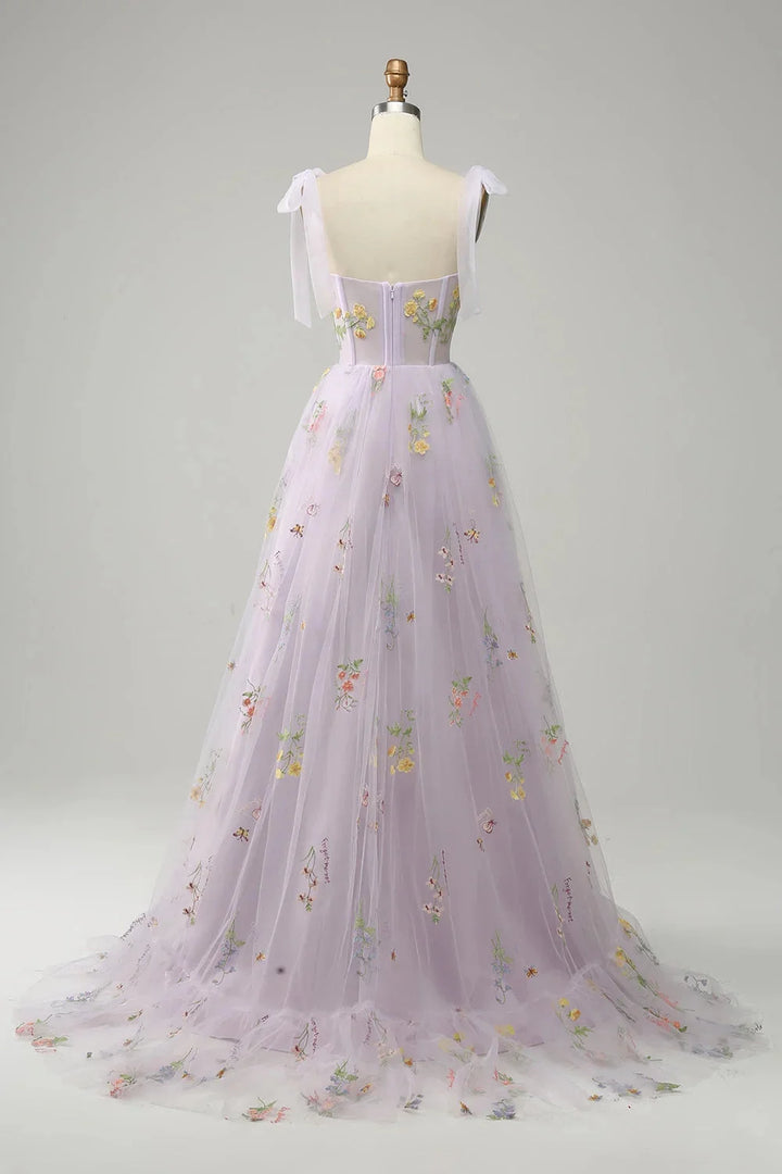"Bianca tulle dress with sheer overlay, featuring elegant embroidery detail on a lightweight and flowy fabric."