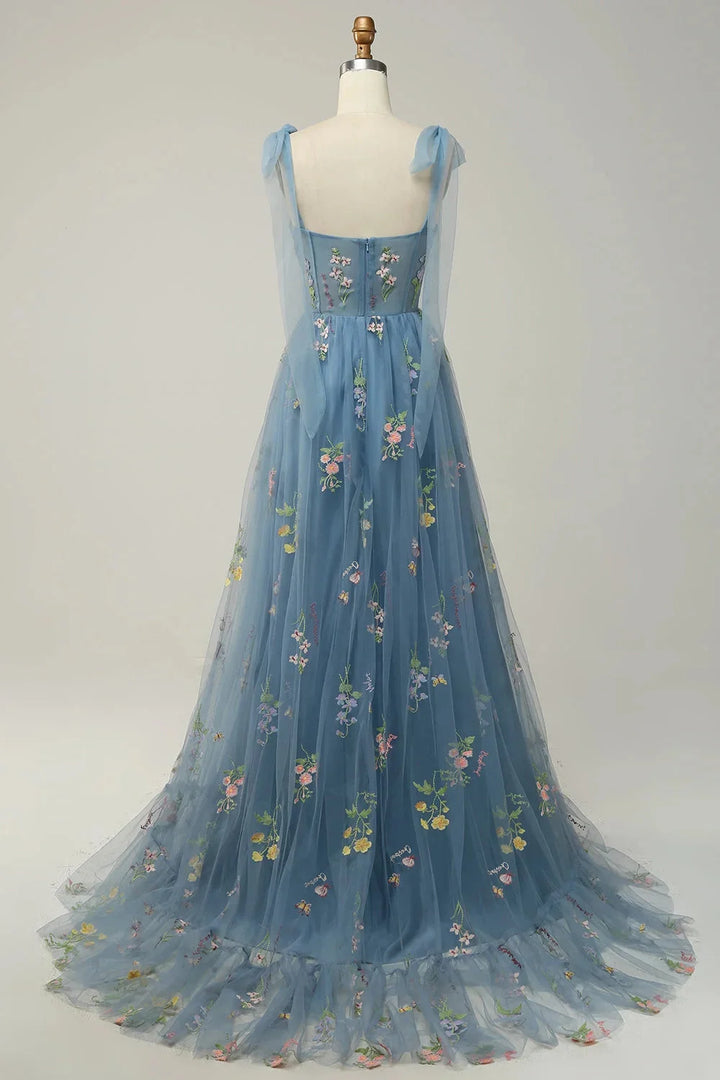 Bianca dress features delicate tulle fabric with intricate embroidery and a sheer overlay, perfect for a sophisticated and…
