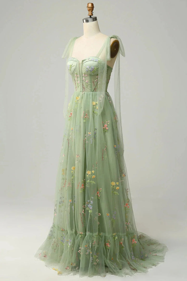 "Bianca embroidered tulle dress with sheer overlay, intricate floral embroidery on delicate sheer fabric."