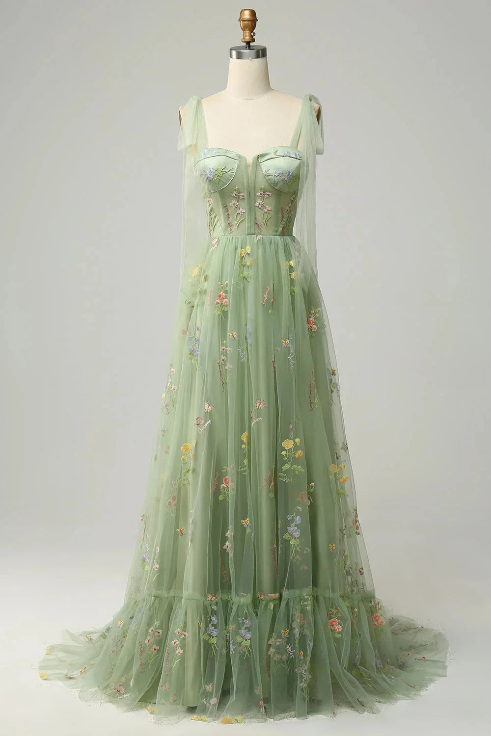 Green Bianca tulle dress with embroidered details, sheer overlay, and a flattering silhouette perfect for special occasions.