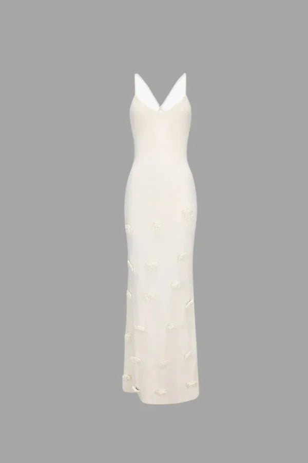 "White Eleonor maxi dress with delicate floral appliqués, ideal for summer events, made from high-quality fabric"