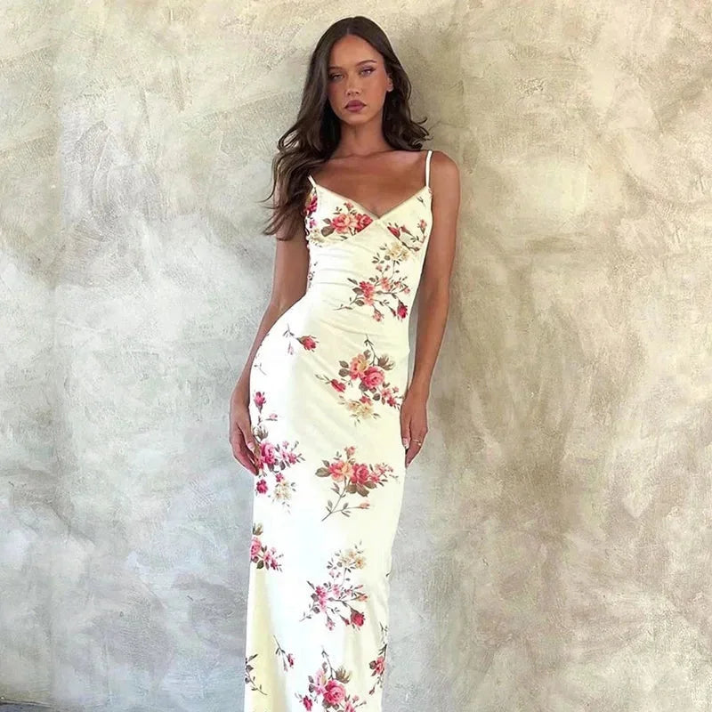 "Adara spaghetti strap floral maxi dress in airy cotton blend with vibrant floral print and sweeping floor-length…
