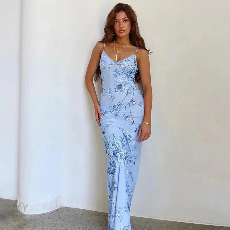 "Adara maxi dress: A floral-patterned dress with spaghetti straps, perfect for summer days. Soft fabric and flowing…
