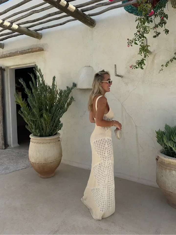 Sleeveless cream knit maxi dress with a unique Rubie design.