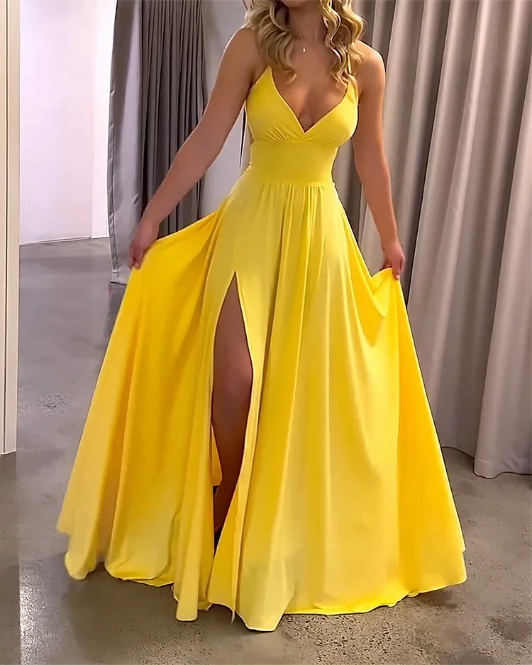 Yellow Imogene maxi dress with deep slit, made from flowy fabric for a relaxed and elegant look.