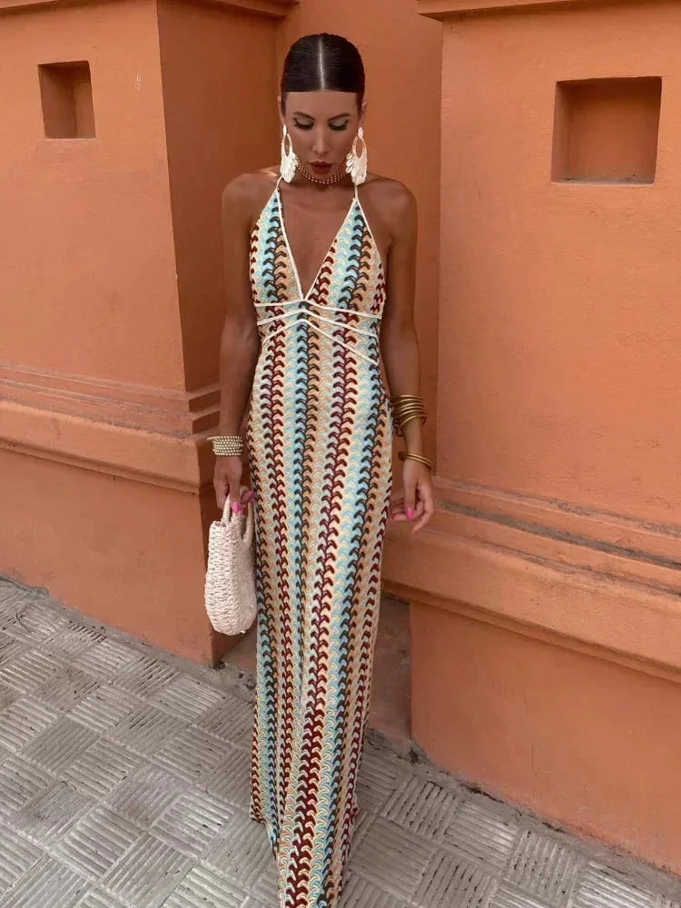 "Blakelee Rainbow Chevron halter maxi dress with waist tie, featuring bold multicolor stripes and a flattering cinched waist…