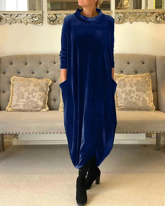 Blue Islah Velvet midi dress with side pockets, featuring a soft and elegant design perfect for everyday wear.